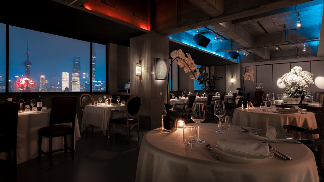 Intimate restaurant dining with warm ambient lighting and comfortable seating